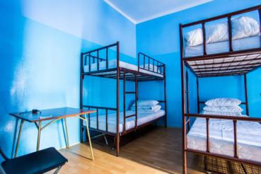 Bed in 10-Bed Dormitory Room with Shared Bathroom