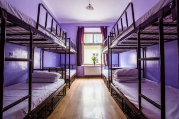 Bed in 8-Bed Dormitory Room with Shared Bathroom